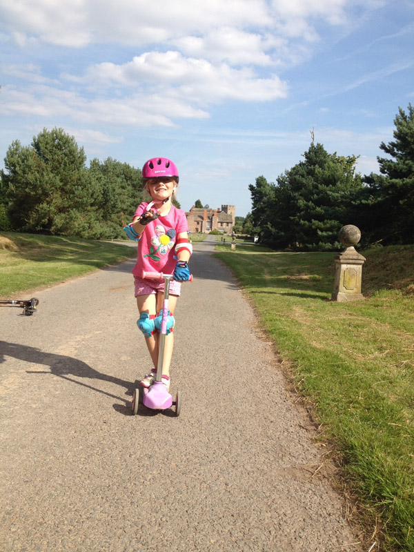 On my scooter on the Walk. Many children learn to ride their bikes here