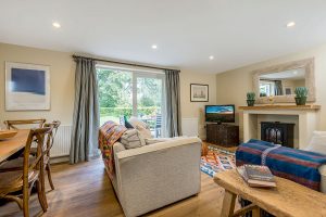 The sitting room in the cottage with french doors onto its own private terrace