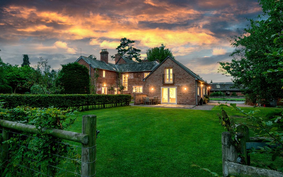 View of cottage on the right handside and Monnington House on the left at dusk