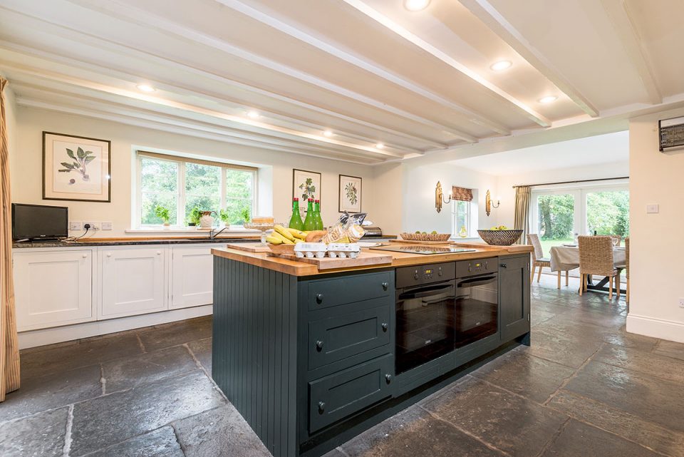 Great working kitchen with large island 2 ovens and aga