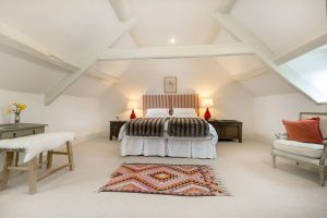 Red Paisley bedroom in the house with superking bed and anatolium rug
