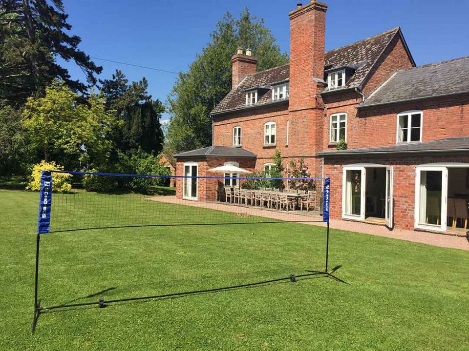 Badminton on the lawn in the huge garden