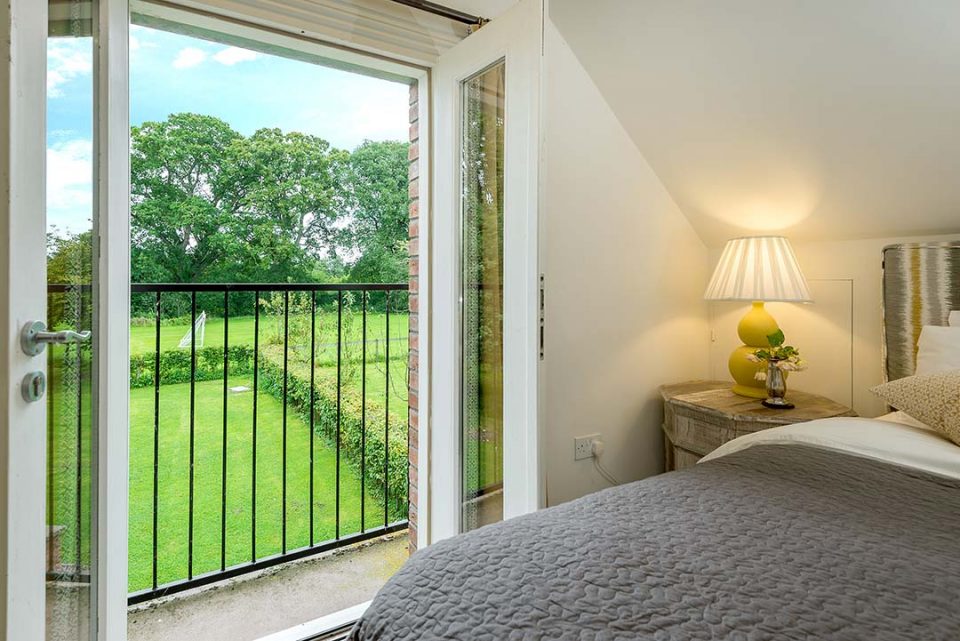 View from Juliet balcony over the garden towards the playing fields