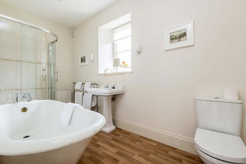 The original roll top bath in the en suite bathroom to Tatiana bedroom in the house