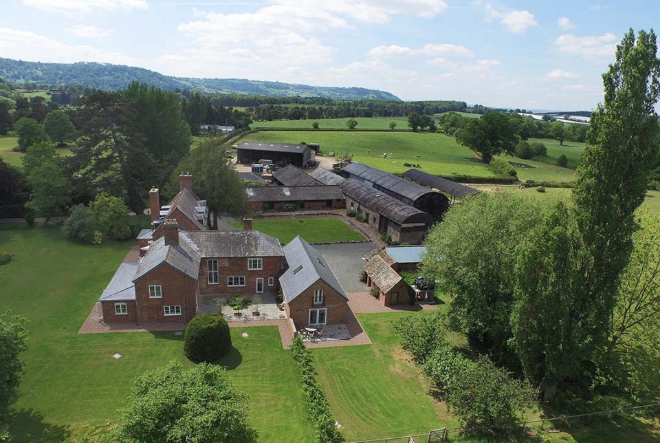 Overview of Monnington House and cottage, huge 2 acre garden, parking area and outbuildings with Wye Valley in distance