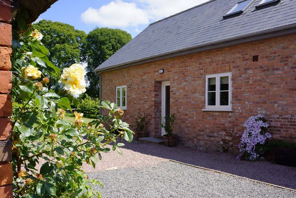 Garden cottage sleeps 6 guests in 3 bedrooms, all ensuites. Has a private garden | Monnington House and Cottages, Herefordshire