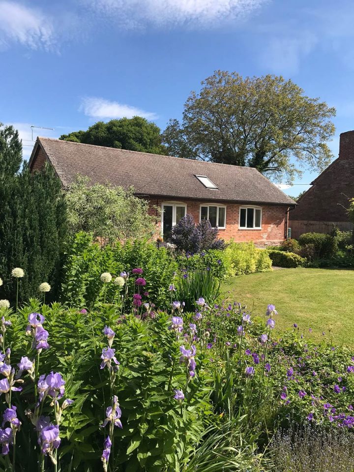 The Cider Mill is a spacious, dog-friendly family holiday cottage with three bedrooms, all ensuites. It has an enclosed garden and ample private parking | Monnington House and Cottages, Herefordshire