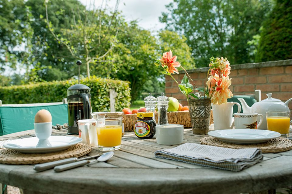 Garden table laid up with breakfast