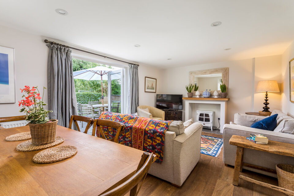 Sitting room with dining table for 6 at Garden Cottage